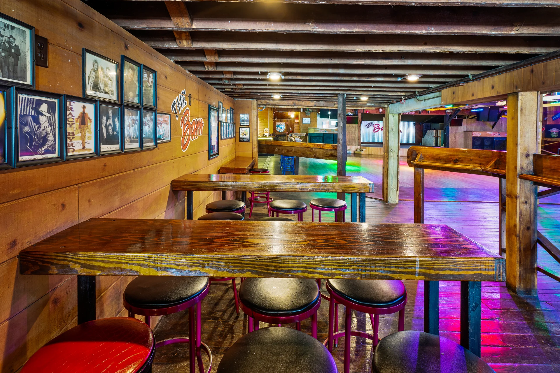 Tables and seating beneath The Barn’s timber beams